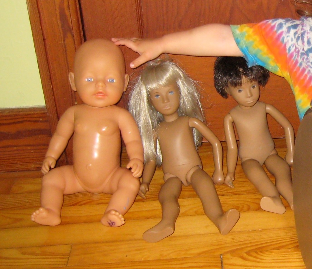 Photograph of three dolls